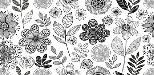 Diverse floral elements and foliage arranged in a visually appealing pattern