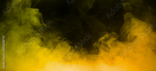 Colorful smoke with yellow orange flare isolated on a black background. abstract neon gradient cloud with splash. thick swirling dust and powder creating a psychedelic light design. smog effect