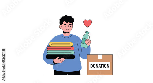 Young man volunteering for charity, holding a stack of clothes and a water bottle to put into a cardboard donation box.