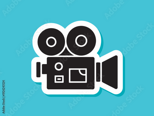 A black and white icon of a vintage film camera on a teal background
