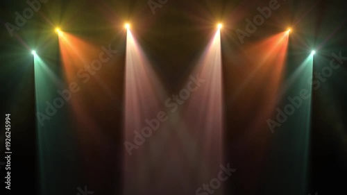 Colorful stage lighting and beams in a dark concert hall for live show music performance