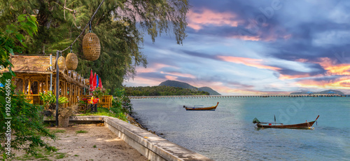 Colourful Skies Sunset over Rawai Beach in Phuket island Thailand. Lovely turquoise blue waters, lush green mountains colourful skies and beautiful views of Pa Tong Patong
