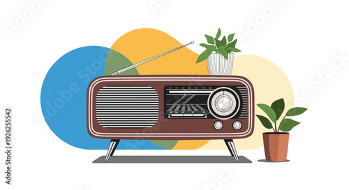 Classic brown vintage radio receiver placed on a surface between two green indoor potted plants with colorful abstract background.