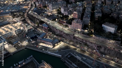 Wallpaper Mural Aerial view of Genova harbor cityscape at dusk with lively urban activity Torontodigital.ca