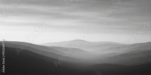 A beautiful sunrise illuminates the orange sky over a misty mountain landscape where fog settles in the valley below the forest hills at dawn