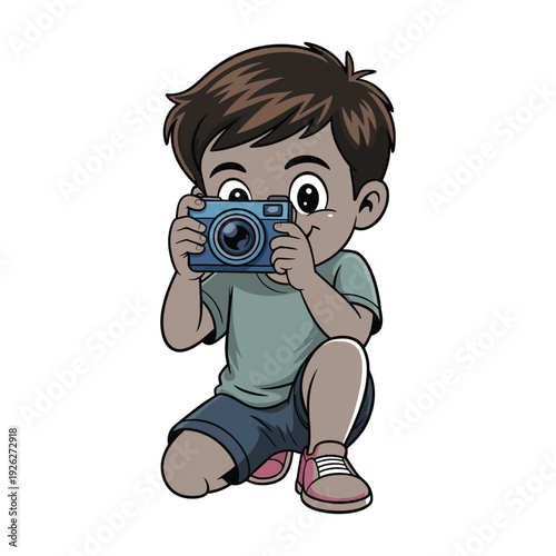 Young boy kneels down holding a blue digital.