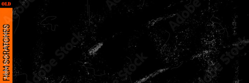 Classic film overlay with scratch dust on paper, warm cinematic light and grain, old film mood with paper texture and scratch marks.