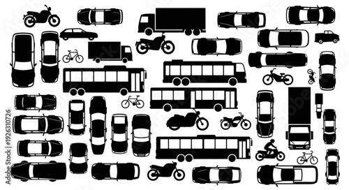 Overhead view of various vehicles, including cars, trucks, and motorcycles, in a dense arrangement.