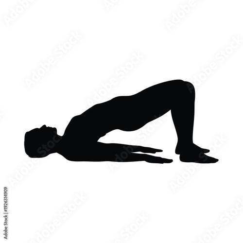 Silhouette of a person performing a glute bridge exercise