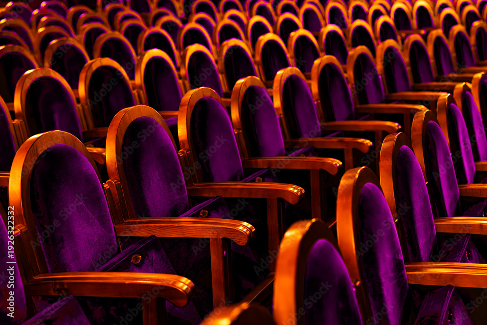 Obraz premium Luxury Purple Velvet Theater Seats with Golden Lighting in Concert Hall