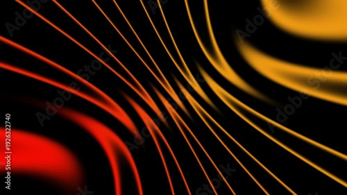 Colorful lines move in patterns on a dark background creating a visual effect in an abstract display