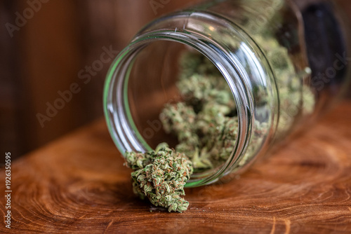 Glass jar full of freshly dried cannabis marijuana buds