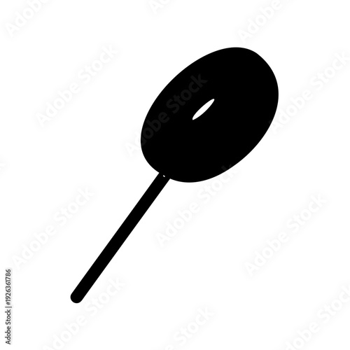 Black lollipop on a stick with a hole in the center