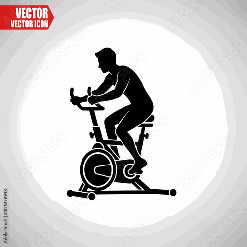A silhouette of a person cycling on a stationary bike