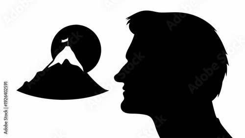 Silhouette of a man's profile with a mountain landscape in his mind symbolizing dreams and aspirations