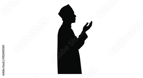 A muslim man in traditional clothing raising hands in prayer silhouette