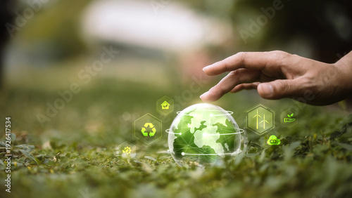 Foto Digital ESG and Sustainable Technology Concept with Hand Touching Green Globe In