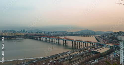 Wallpaper Mural Zoom out hyperlapse of heavy traffic on Gangbyeonbuk-ro expressway, Donho Bridge over Han River, Gangnam and Hannam skyline, mountains, warm hazy winter sunset over Seoul cityscape Torontodigital.ca