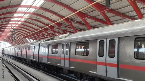 New Delhi, India, April 16 2025 - Delhi Metro train arriving at Jhandewalan metro station in New Delhi, India, Asia, Public Metro departing from Jhandewalan station