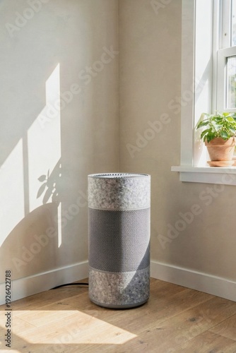 Modern cylindrical air purifier in sun-lit living room corner