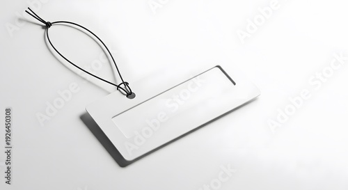 Blank white gift tag with twisted wire on white background isolated on white