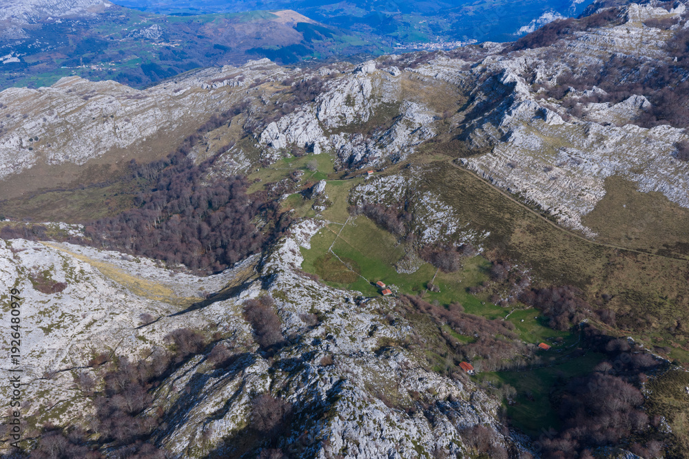 Fototapeta premium Aerial view from a drone of Mount Mortillano in the karst massif of the Sierra de Hornijo. Collados del Asón Natural Park. Soba Valley. Pasiegos Valleys. Cantabria. Spain. Europe