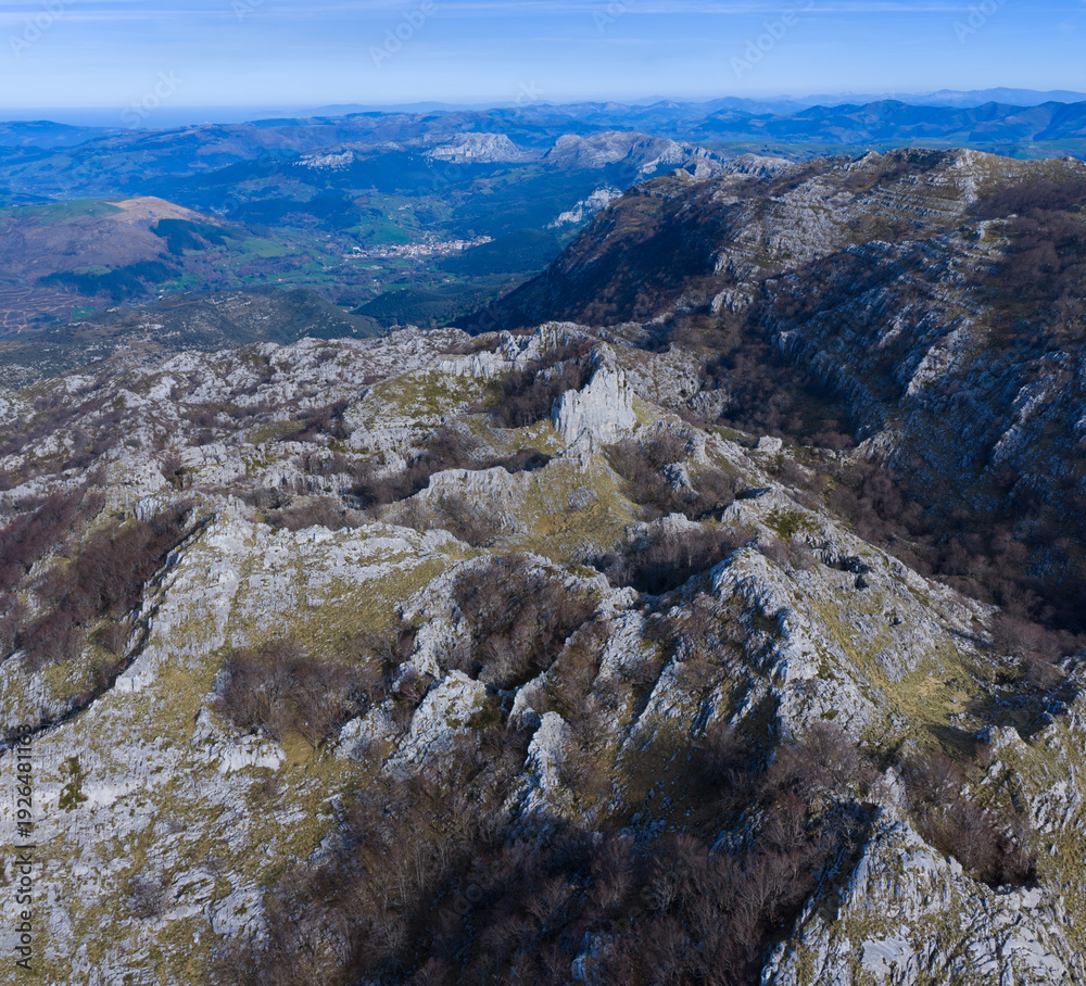 Obraz premium Aerial view from a drone of Mount Mortillano in the karst massif of the Sierra de Hornijo. Collados del Asón Natural Park. Soba Valley. Pasiegos Valleys. Cantabria. Spain. Europe