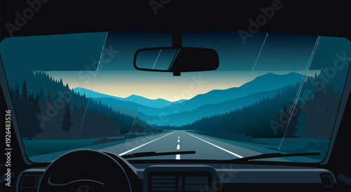 Serene Mountain Road Through Paved Landscape with Evergreen Forests at Sunset