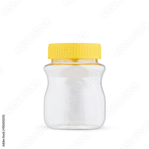 Foto Empty glass jar with yellow lid isolated on white minimalist storage container
