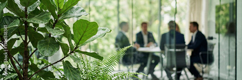 Business Meeting in Eco-Friendly Office with Lush Plants and Natural Light