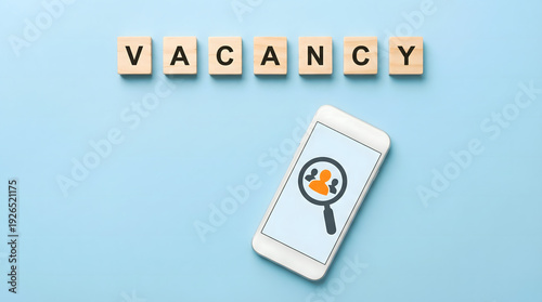 Free Download Vacancy spelled with wooden letters above smartphone showing job search icon - GFXLoad