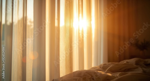Sunset sunlight beaming through partially open curtains illuminating space