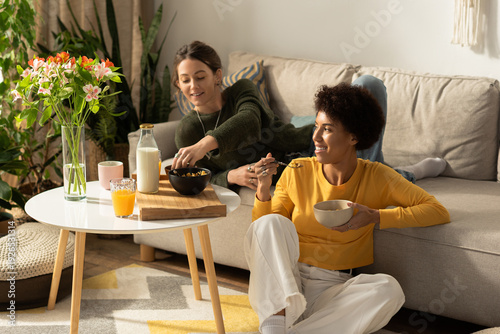 фотографія Happy moments shared between a loving lesbian couple in a cozy living room