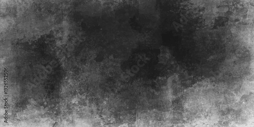 A dark and aged black and white grunge background features a textured stone surface with a vintage gray concrete pattern and a rough dirty paper frame for an old blank wall backdrop
