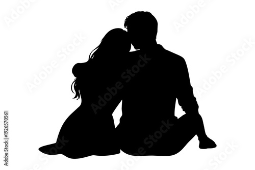 Silhouette of couple embracing while sitting.