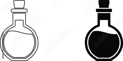 Two glass bottles with stoppers one empty and one filled with liquid side by side