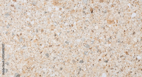 Beige terrazzo marble surface texture background with gentle studio lighting