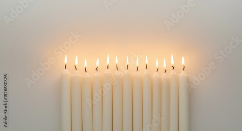 White candles radiating a s...