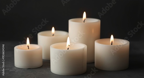 White candles casting a ser...
