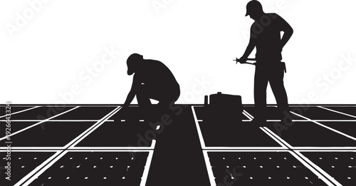 Black silhouettes of two workers installing solar panels