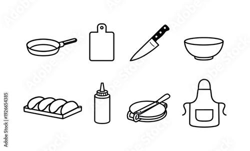 Home taco making tools: frying pan, cutting board, chef knife, mixing bowl, serving tray, sauce bottle, tortilla press, apron