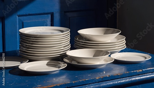 White dishes on the blue table