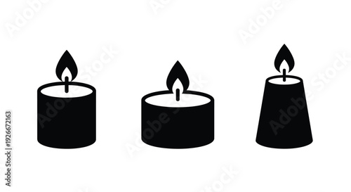 Three black candles with flickering flames a striking silhouette