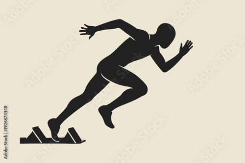 Silhouette of a sprinter poised on starting blocks ready to race.