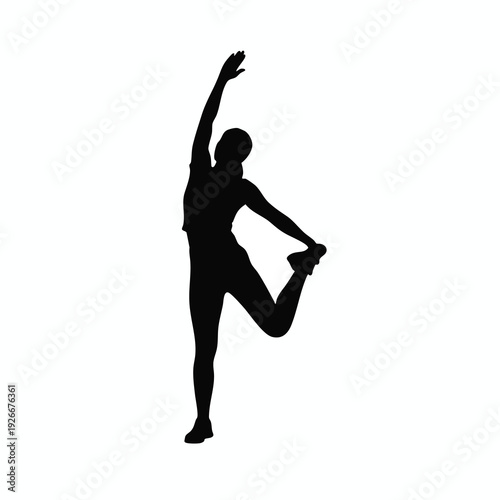 Silhouette of a Female Dancer Performing a Graceful Pose on Stage