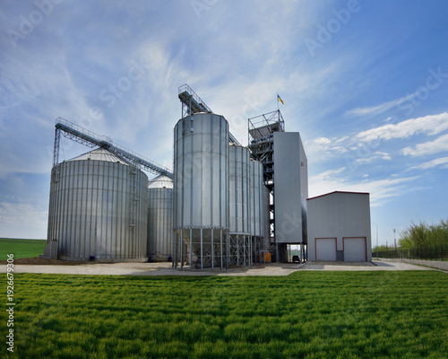 metal silos for storage, grain elevator complex for receiving, cleaning, drying and long-term storage, norias for lifting grain and a working tower