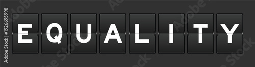 Black color analog flip board with word equality on gray background