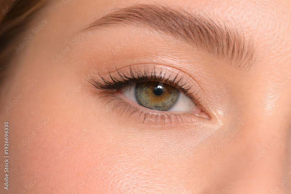 Fototapeta premium Close-up of a beautiful eye with striking green hues