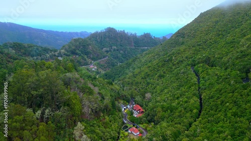 Drone Shot Over Green Valleys and Curving Roads, Madeira Island Portugal
