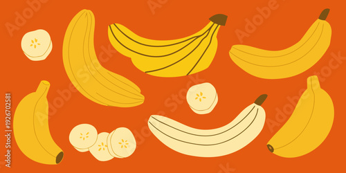 A playful arrangement of ripe bananas and banana slices on orange